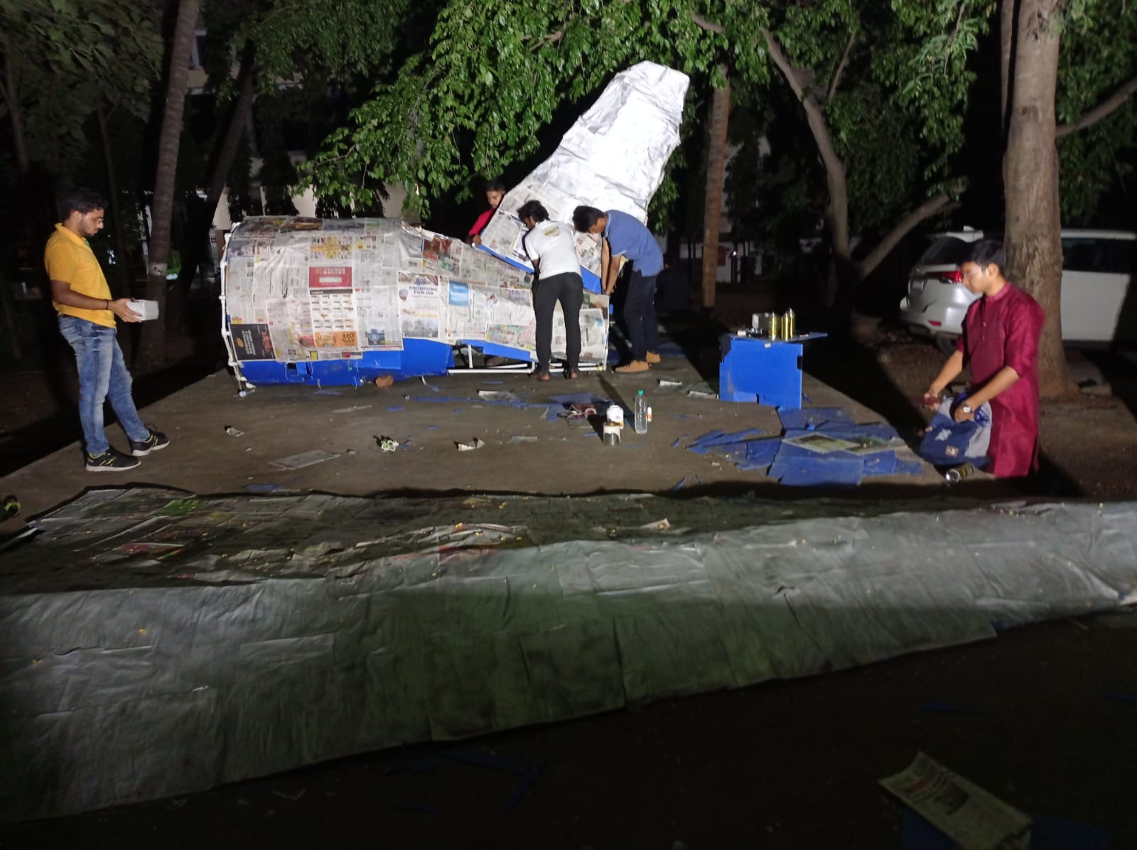 Team assembling wing components for new aircraft prototype